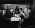 Picking up the tab in train dining car Royalty Free Stock Photo