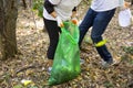 Picking up trash in the forest