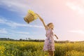 Picking up yellow daisies in a field Royalty Free Stock Photo