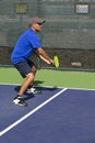 Pickleball Action - Man in Blue Guarding the Sideline During A Match