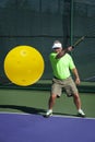 Pickleball Action - Senior Male Player Hitting Backhand with Smile