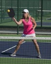 Pickleball - Female Hitting Ball At Net