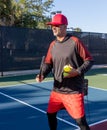 Pickleball instructor demonstrates the proper way to hold a paddle