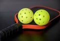 Pickleball paddles and pickleballs