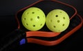 Pickleball paddles and pickleballs