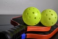 Pickleball paddles and pickleballs