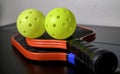 Pickleball paddles and pickleballs