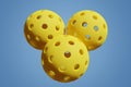 Pickleball three yellow sports balls on an isolated background. Closeup 3D rendering Royalty Free Stock Photo