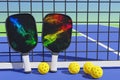 Pickleball two racket design and balls for playing in a net on a sports field. 3D rendering