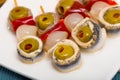 Pickled anchovy rolls with olives, pepper, onion Royalty Free Stock Photo