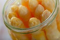 Pickled asparagus in glass jar on a wooden surface Royalty Free Stock Photo