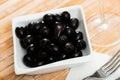 Pickled black olives in white bowl Royalty Free Stock Photo