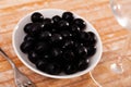 Pickled black olives in white bowl Royalty Free Stock Photo