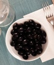 Pickled black olives in white bowl Royalty Free Stock Photo
