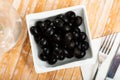 Pickled black olives in white bowl Royalty Free Stock Photo