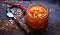 Pickled bulgarian peppers in a glass jar