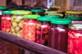 Pickled canned vegetables in colorful jars