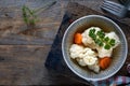 Pickled cauliflower with carrots in a glass jar on a dark wooden table. Fermented food. Copy space. top view Royalty Free Stock Photo