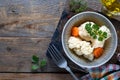 Pickled cauliflower with carrots in a glass jar on a dark wooden table. Fermented food. Copy space. top view Royalty Free Stock Photo