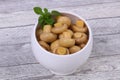 Pickled champignon heap in the bowl Royalty Free Stock Photo