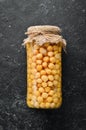 Pickled chickpeas in a glass jar. Turkish peas