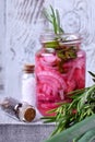 Pickled chopped red onion in a glass jar