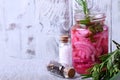 Pickled chopped red onion in a glass jar