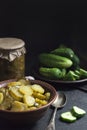 Pickled cucumber salad in a bowl and jar Royalty Free Stock Photo