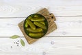 Pickled cucumbers in bowl. Homemade marinated gherkins. Top view. Royalty Free Stock Photo