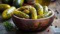 Pickled cucumbers in bowl on wooden rustic board Royalty Free Stock Photo