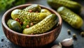 Pickled cucumbers in bowl on wooden rustic board Royalty Free Stock Photo