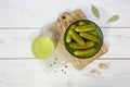 Pickled cucumbers in a ceramic bowl, pickle juice in glass. Homemade marinated gherkins. Top view. Royalty Free Stock Photo