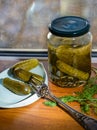 Pickled cucumbers in glass jar.