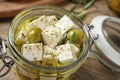 Pickled feta cheese in jar on wooden table Royalty Free Stock Photo