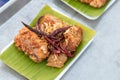 Pickled fish fried on banana leaf in foam box. Royalty Free Stock Photo