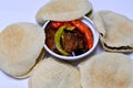 Pickled fried aubergine, green pepper, Traditional Egyptian breakfast street sandwiches of mashed fava beans, fried crispy falafel