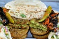 Pickled fried aubergine and green peppers, Traditional Egyptian popular breakfast street sandwiches of mashed fava beans, fried