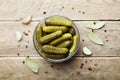 Pickled gherkins or cucumbers in bowl on wooden rustic table from above. Royalty Free Stock Photo