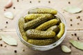 Pickled gherkins or cucumbers in bowl on wooden vintage table. Royalty Free Stock Photo