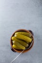 Pickled gherkins with mustard and garlic on a stone rusty background Royalty Free Stock Photo