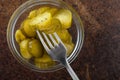 LPickled gherkins with mustard and garlic on a stone rusty background Royalty Free Stock Photo