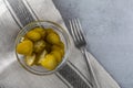 Pickled gherkins with mustard and garlic on a stone rusty background Royalty Free Stock Photo