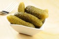 Pickled gherkins in a small bowl Royalty Free Stock Photo