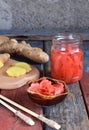 Pickled ginger slices and wooden chopsticks. Ingredient for sushi. Healthy food. Traditional Japanese condiment Royalty Free Stock Photo