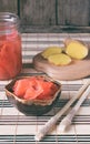 Pickled ginger slices and wooden chopsticks. Ingredient for sushi. Healthy food. Traditional Japanese condiment Royalty Free Stock Photo