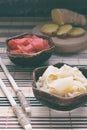 Pickled ginger slices and wooden chopsticks. Ingredient for sushi. Healthy food. Traditional Japanese condiment Royalty Free Stock Photo