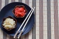 Pickled ginger slices and wooden chopsticks. Ingredient for sushi. Healthy food. Traditional Japanese condiment Royalty Free Stock Photo