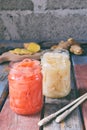 Pickled ginger slices and wooden chopsticks. Ingredient for sushi. Healthy food. Traditional Japanese condiment Royalty Free Stock Photo