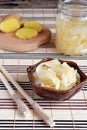 Pickled ginger slices and wooden chopsticks. Ingredient for sushi. Healthy food. Traditional Japanese condiment Royalty Free Stock Photo