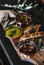 Pickled Greek olives, olive oil and herbed focaccia slices Royalty Free Stock Photo